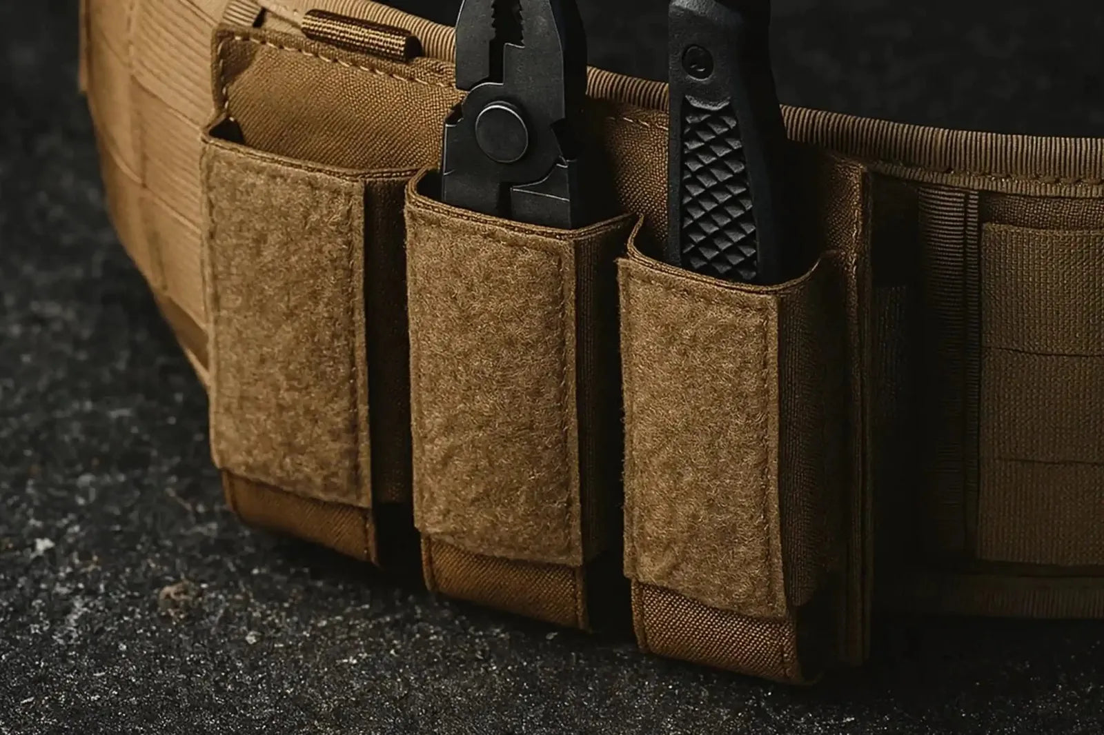 Tactical brown flashlight holster belt with multipurpose tool pouches on dark surface