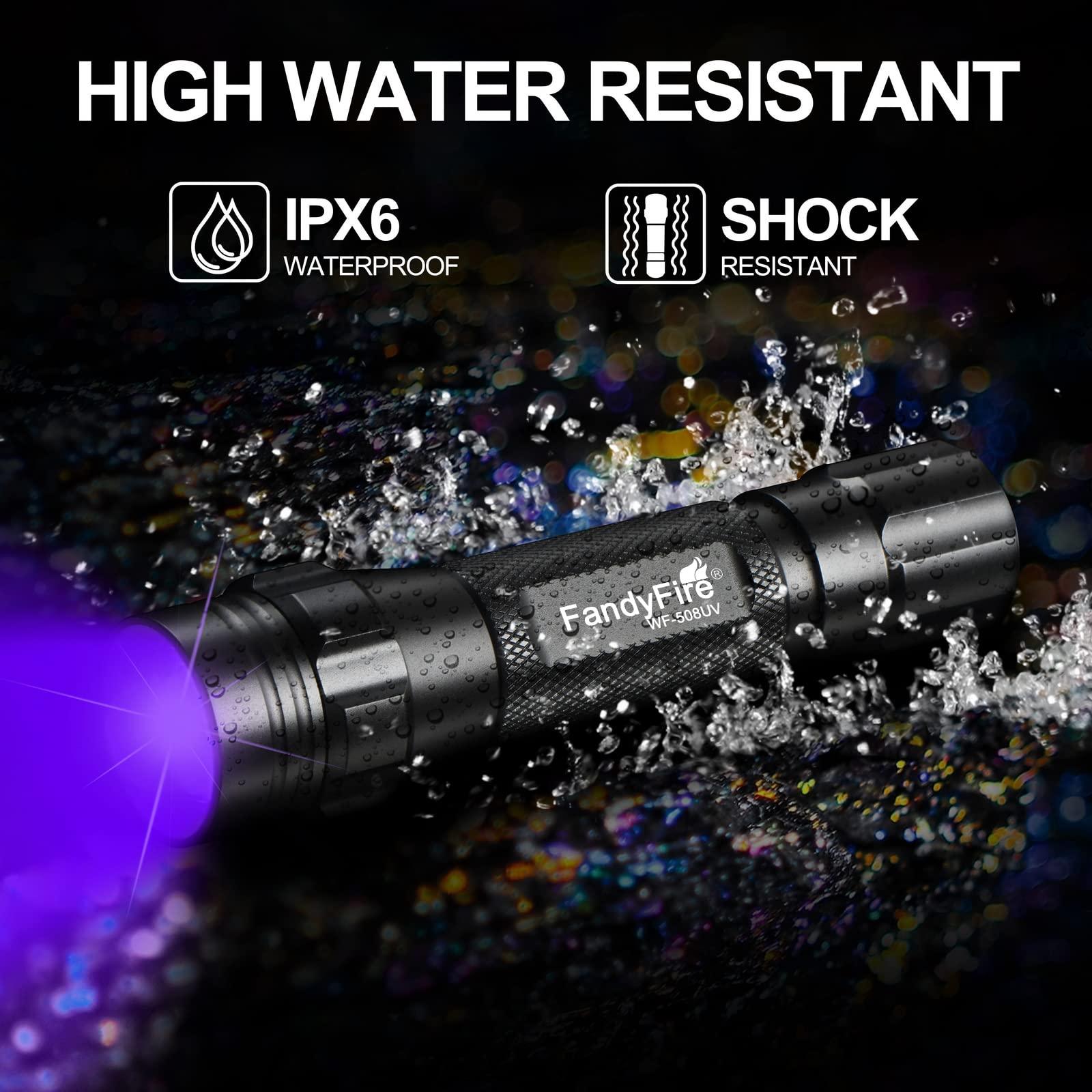 FandyFire black waterproof shock resistant flashlight emitting purple light in splashing water